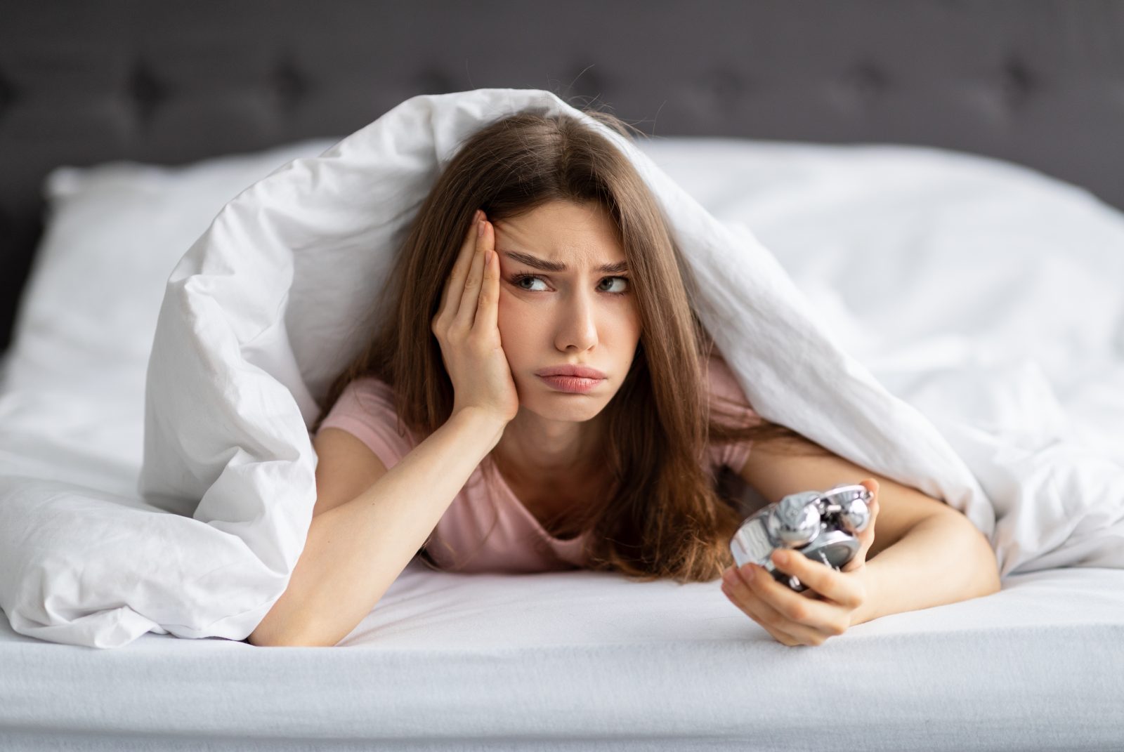 Woman lying in bed, unable to sleep – online psychiatry in Spokane, WA